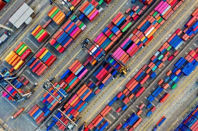 Aerial view of shipping containers in a global logistics hub