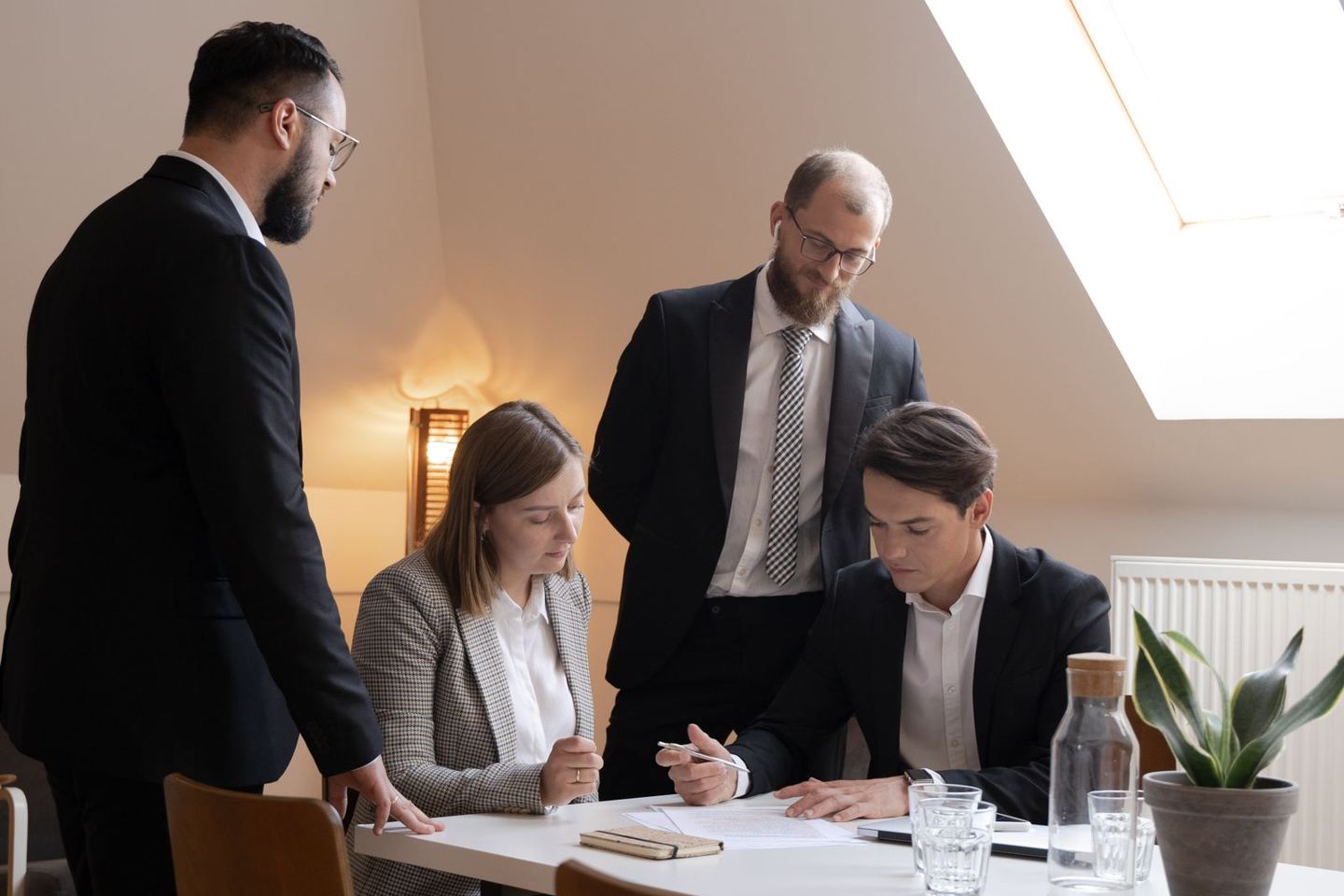 An investment team reviewing documents during a focused committee discussion